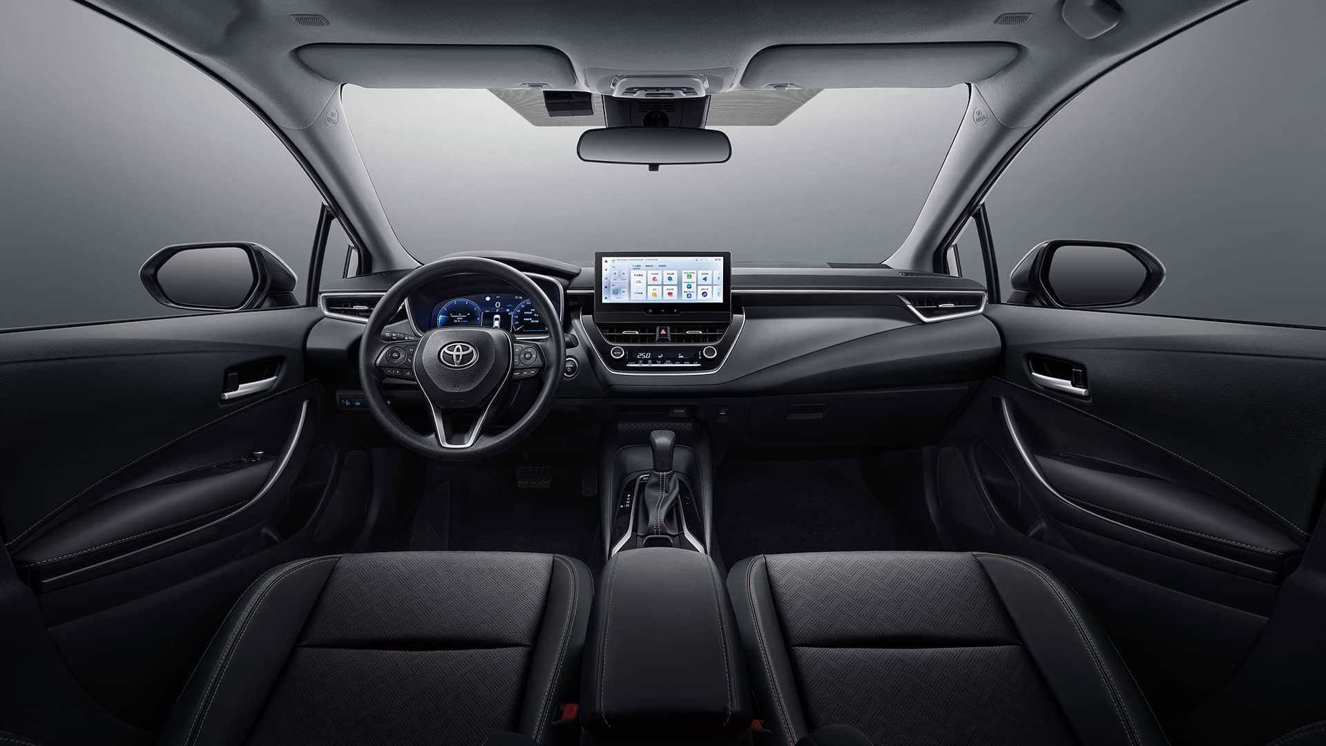 Black kettle with long pour spot and angled body on marble counter next to coffee mug and pour-over system.